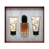 Giorgio Armani Si perfume gift set featuring a central 100ml bottle of Eau de Parfum with a black cap, flanked by two 50ml tubes of body lotion and shower gel, all in a textured gray box with a dark reddish-brown border.
